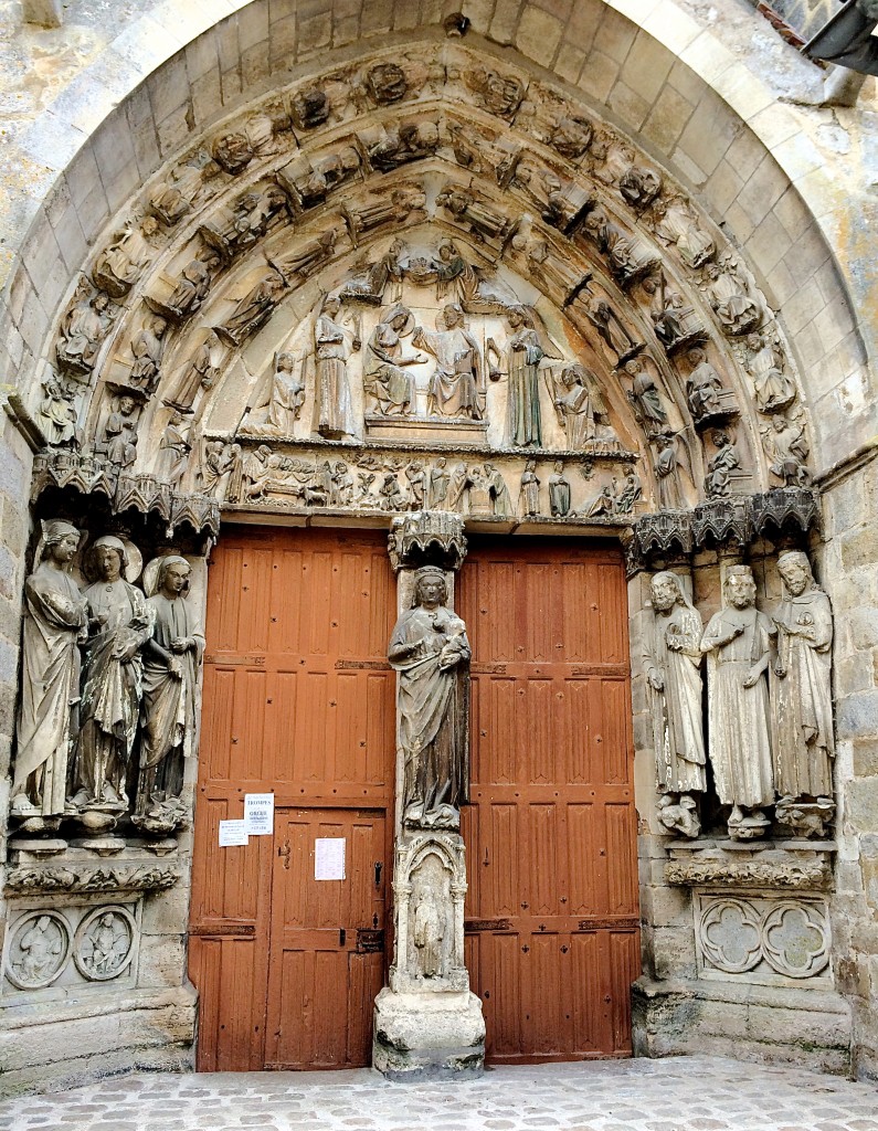 13th c doors of Notre Dame de Villeneuve l'Archeveque classified as a Monument Historique